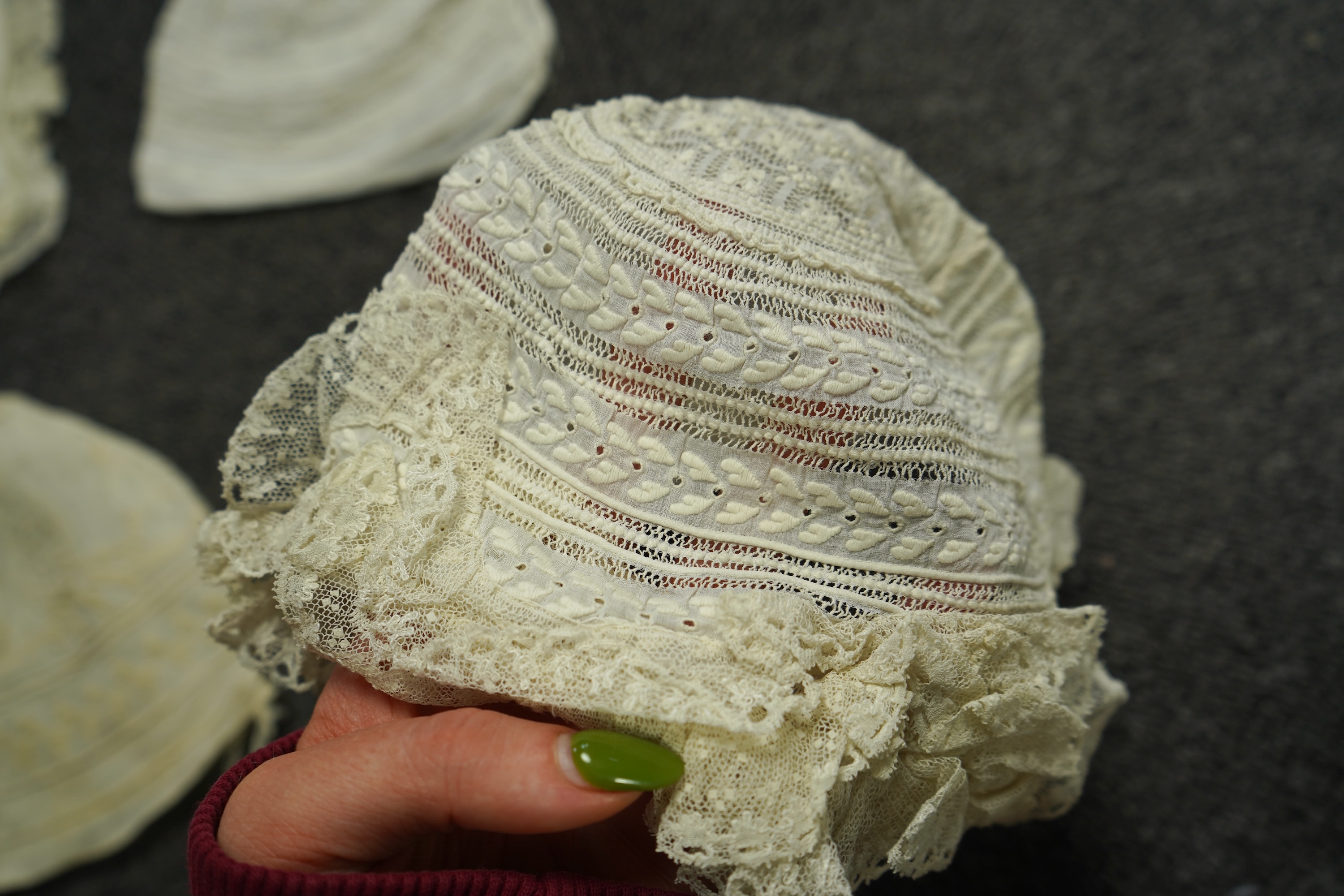 A collection of six baby’s bonnets from the mid 18th century to the late 19th century. An 18th century Hollie Point inserted baby bonnet, a quilted 18th century baby bonnet, two white work bonnets with needle lace crown